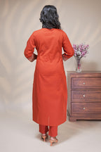 women rust orange cotton straight kurta pant and dupatta set with embroidered yoke