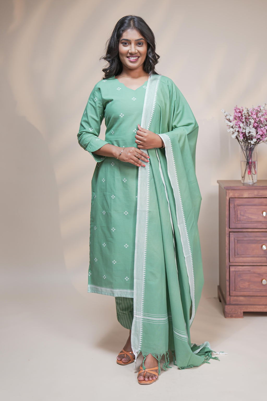 women mint green polka print straight kurta set with matching pant and dupatta