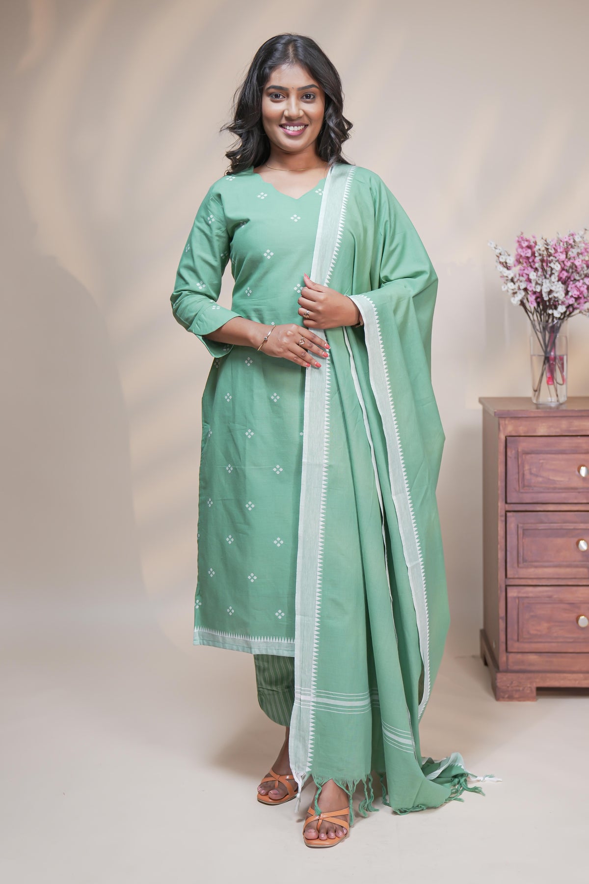women mint green polka print straight kurta set with matching pant and dupatta