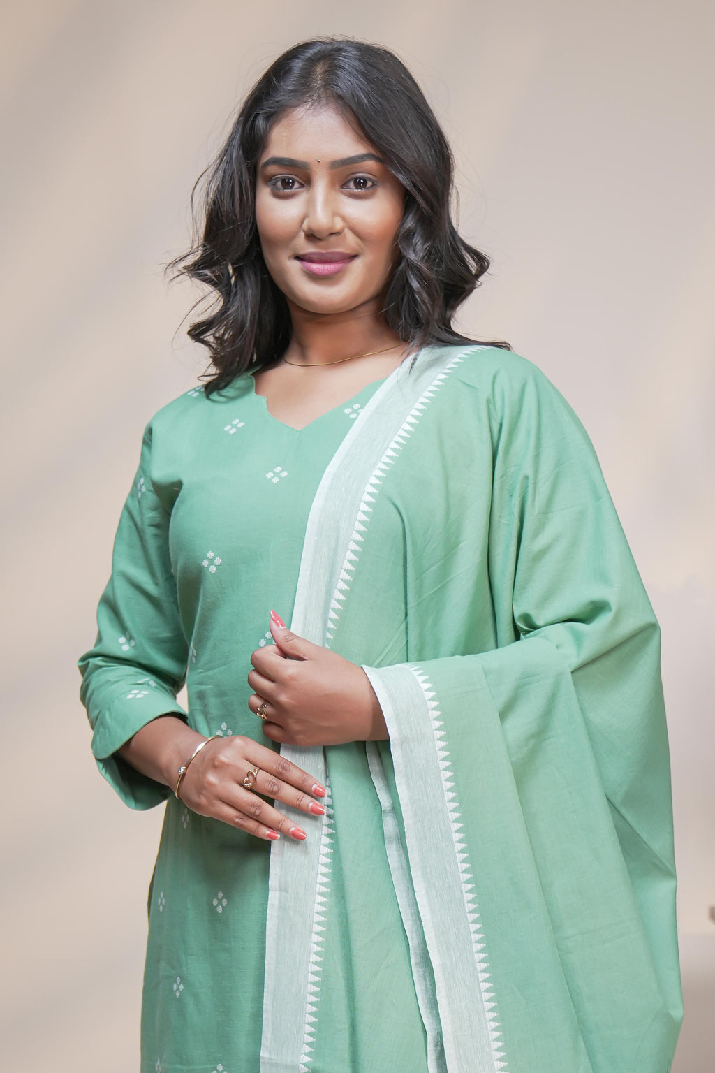 women mint green polka print straight kurta set with matching pant and dupatta