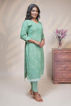 women mint green polka print straight kurta set with matching pant and dupatta