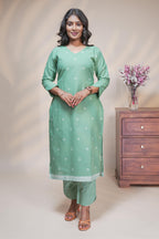 women mint green polka print straight kurta set with matching pant and dupatta