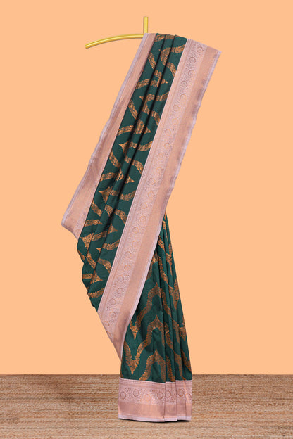 Green zig zag zari design semi soft silk saree with contrast border and floral printed blouse