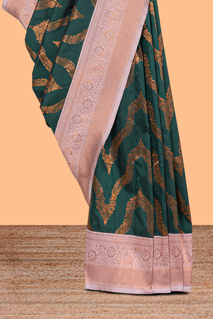 Green zig zag zari design semi soft silk saree with contrast border and floral printed blouse