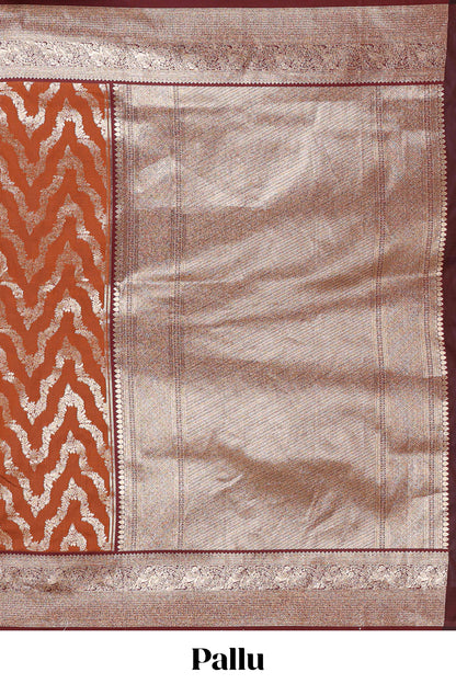 Brown zig zag zari design semi soft silk saree with contrast border and floral printed blouse