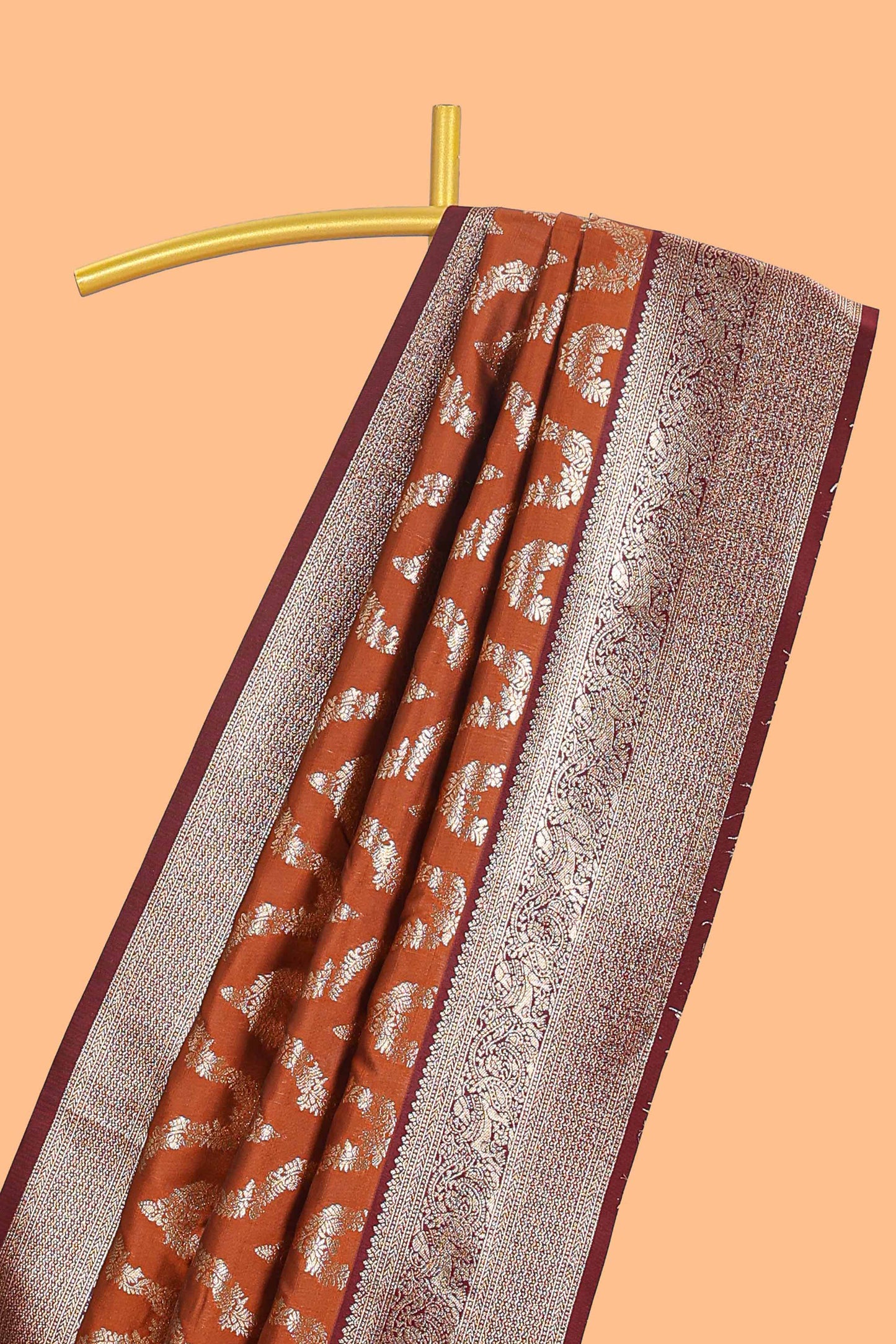 Brown zig zag zari design semi soft silk saree with contrast border and floral printed blouse