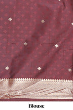 Brown zig zag zari design semi soft silk saree with contrast border and floral printed blouse