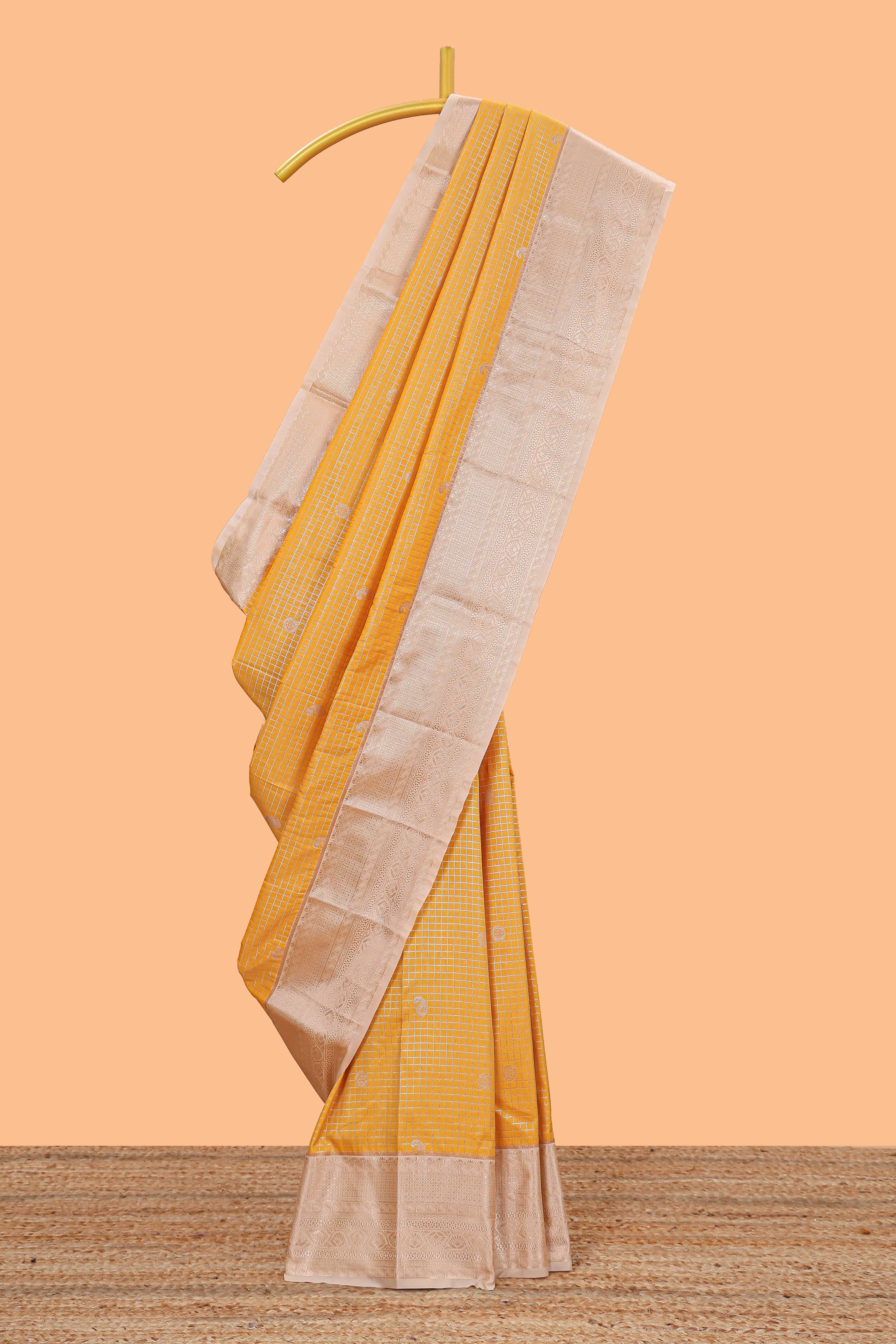 Mustard checked zari butta semi soft silk saree with contrast border and pallu