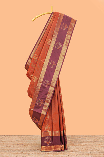 Bright orange striped zari motifs semi soft silk saree with contrast bentex border and pallu