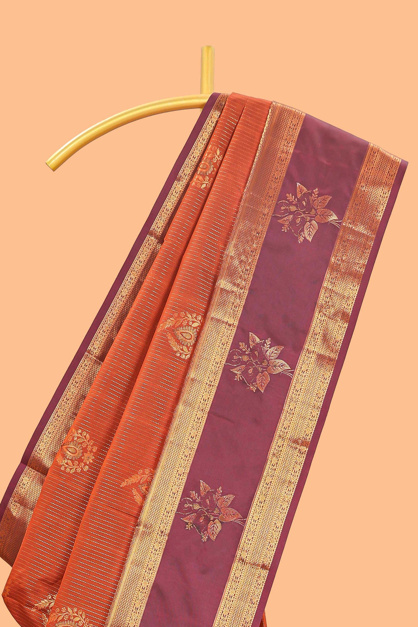Bright orange striped zari motifs semi soft silk saree with contrast bentex border and pallu