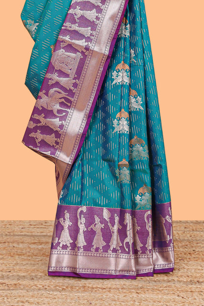 Green geometric design birds zari motifs  semi soft silk saree with contrast border and floral design pallu