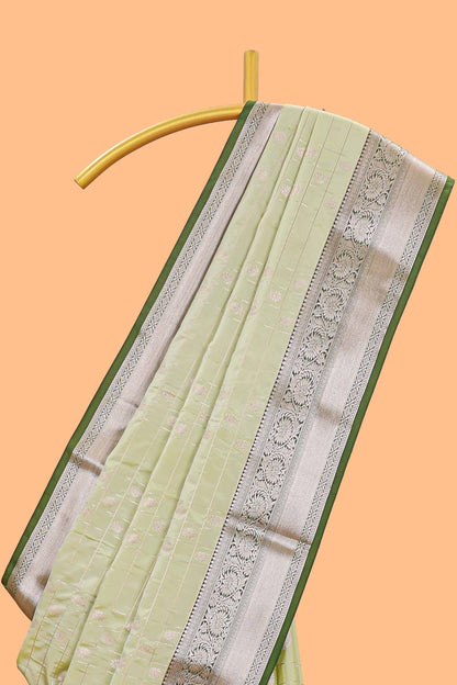 Green checked zari buttas semi soft silk saree with contrast zari border and floral design pallu