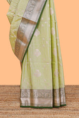 Green checked zari buttas semi soft silk saree with contrast zari border and floral design pallu