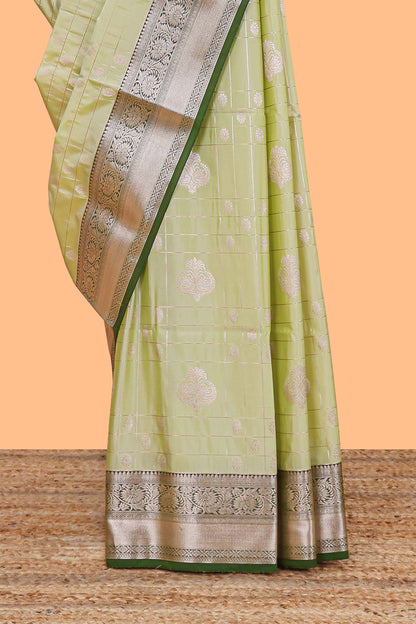 Green checked zari buttas semi soft silk saree with contrast zari border and floral design pallu