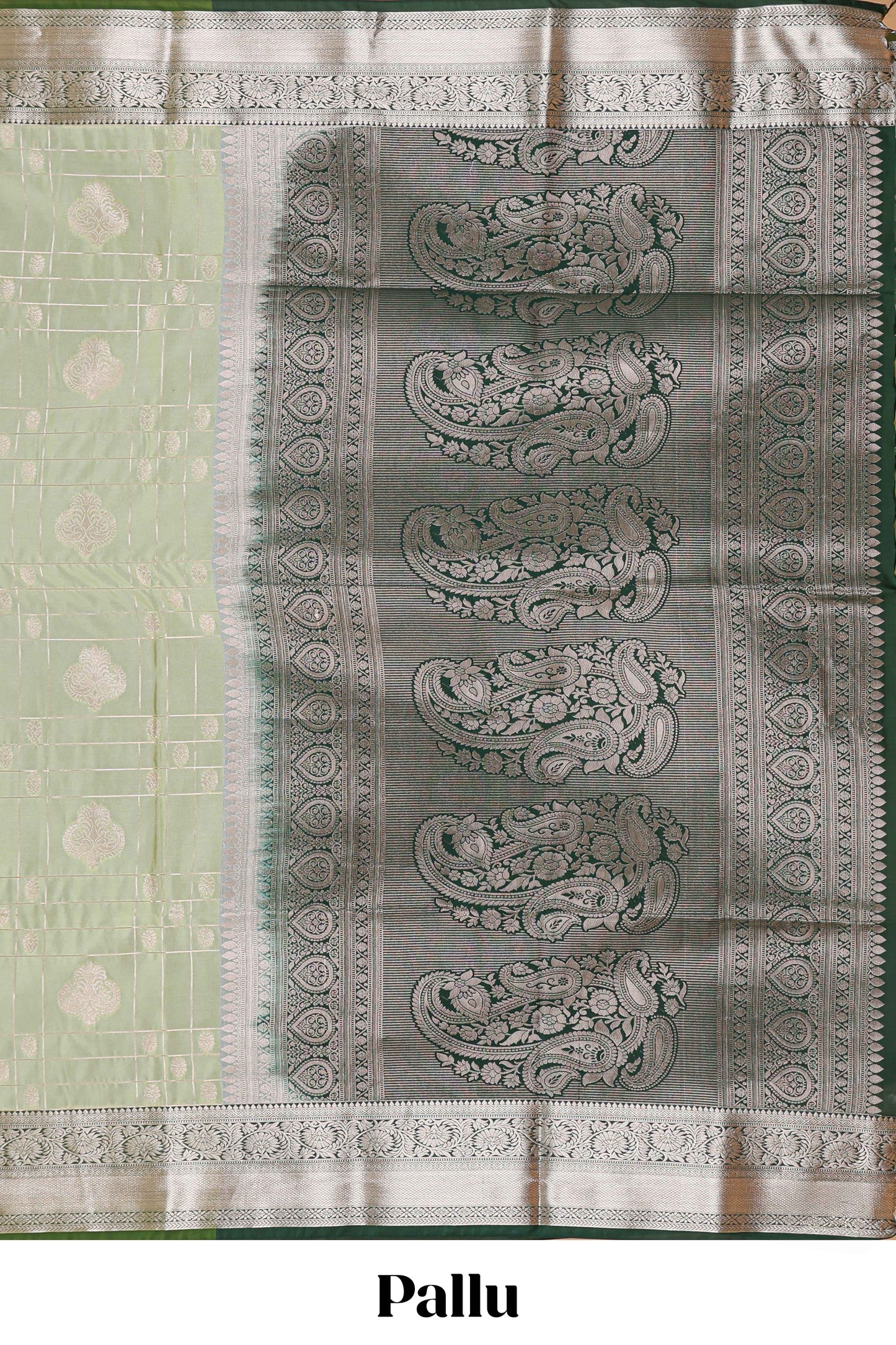 Green checked zari buttas semi soft silk saree with contrast zari border and floral design pallu