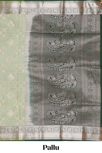 Green checked zari buttas semi soft silk saree with contrast zari border and floral design pallu