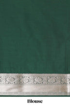 Green checked zari buttas semi soft silk saree with contrast zari border and floral design pallu
