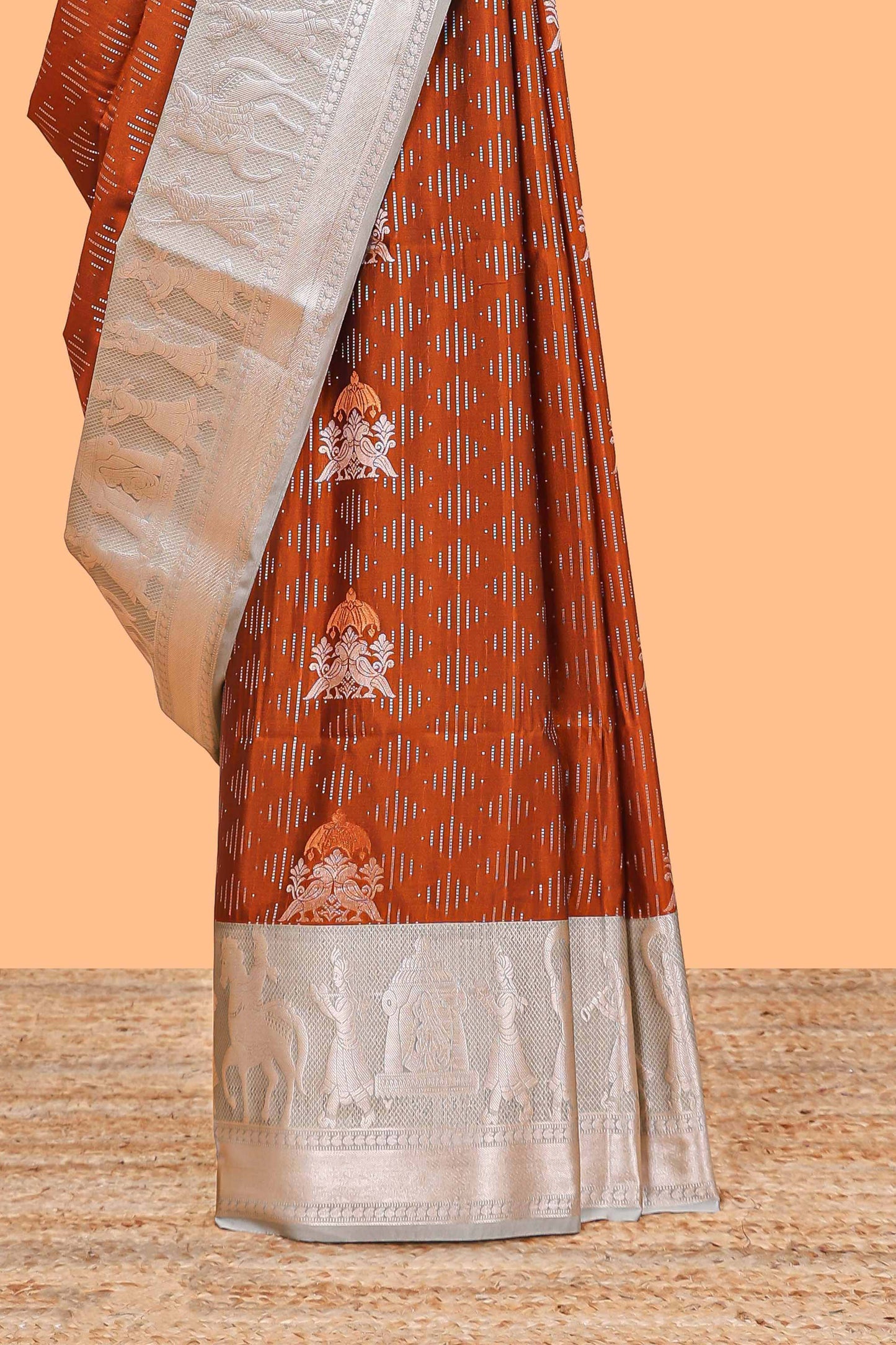 Orange geometric design birds zari motifs  semi soft silk saree with contrast border and floral design pallu