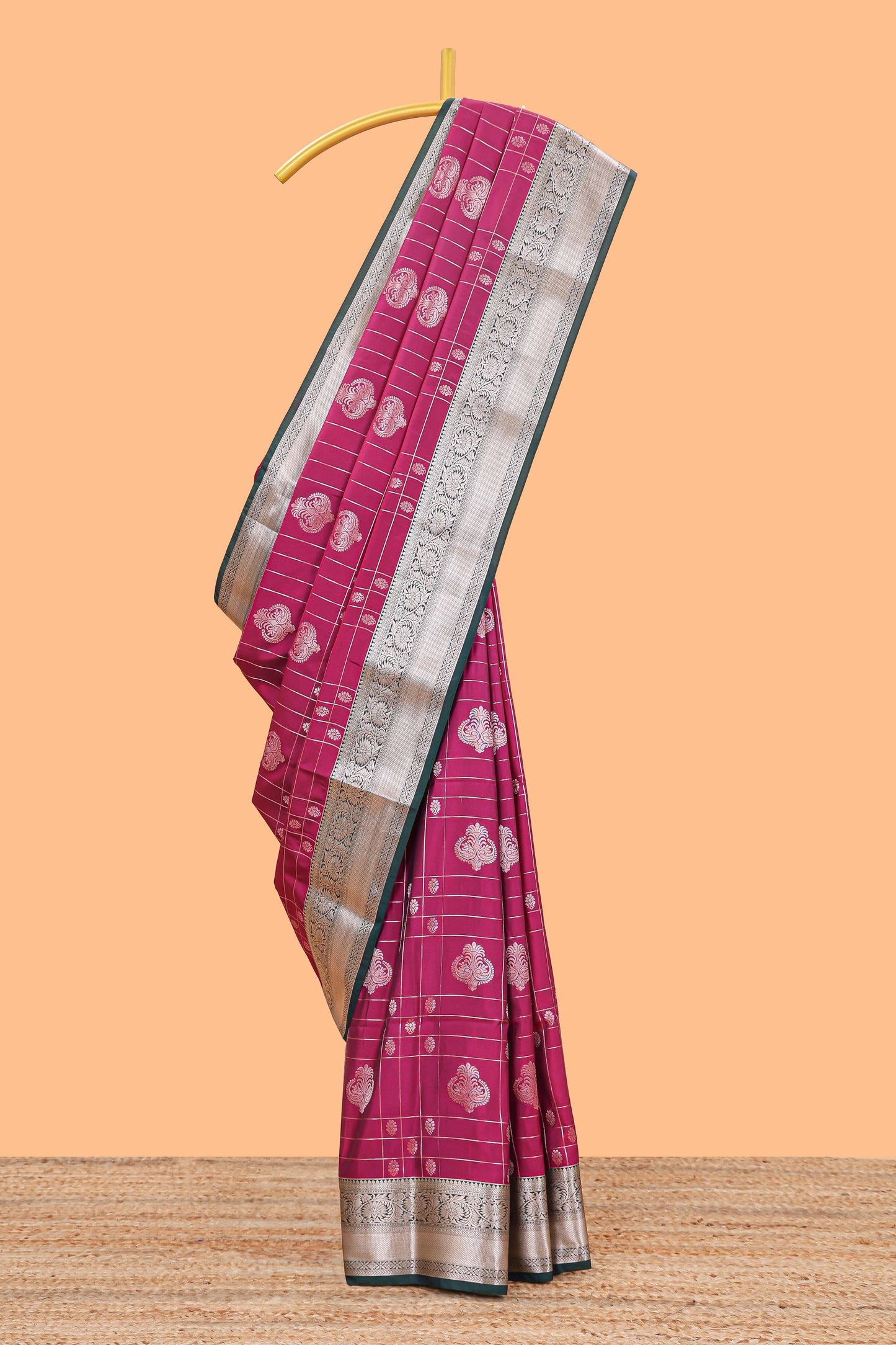 Rani pink checked zari buttas semi soft silk saree with contrast zari border and floral design pallu