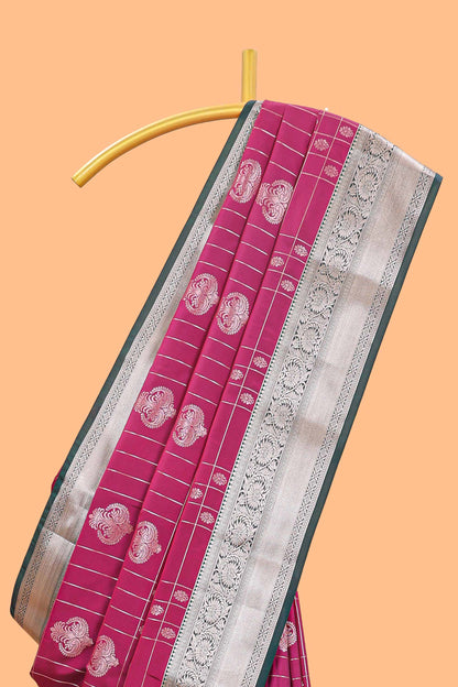 Rani pink checked zari buttas semi soft silk saree with contrast zari border and floral design pallu