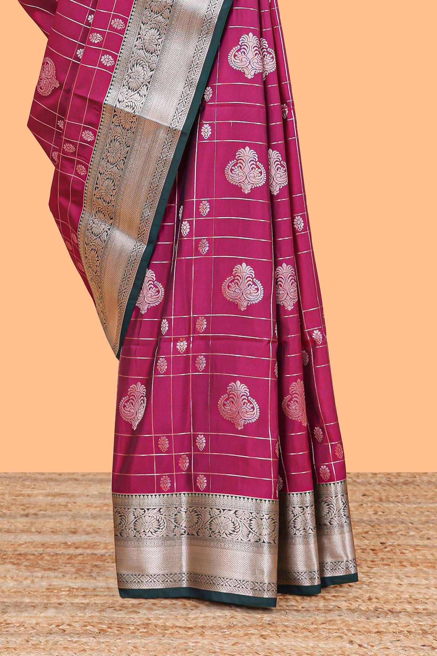 Rani pink checked zari buttas semi soft silk saree with contrast zari border and floral design pallu