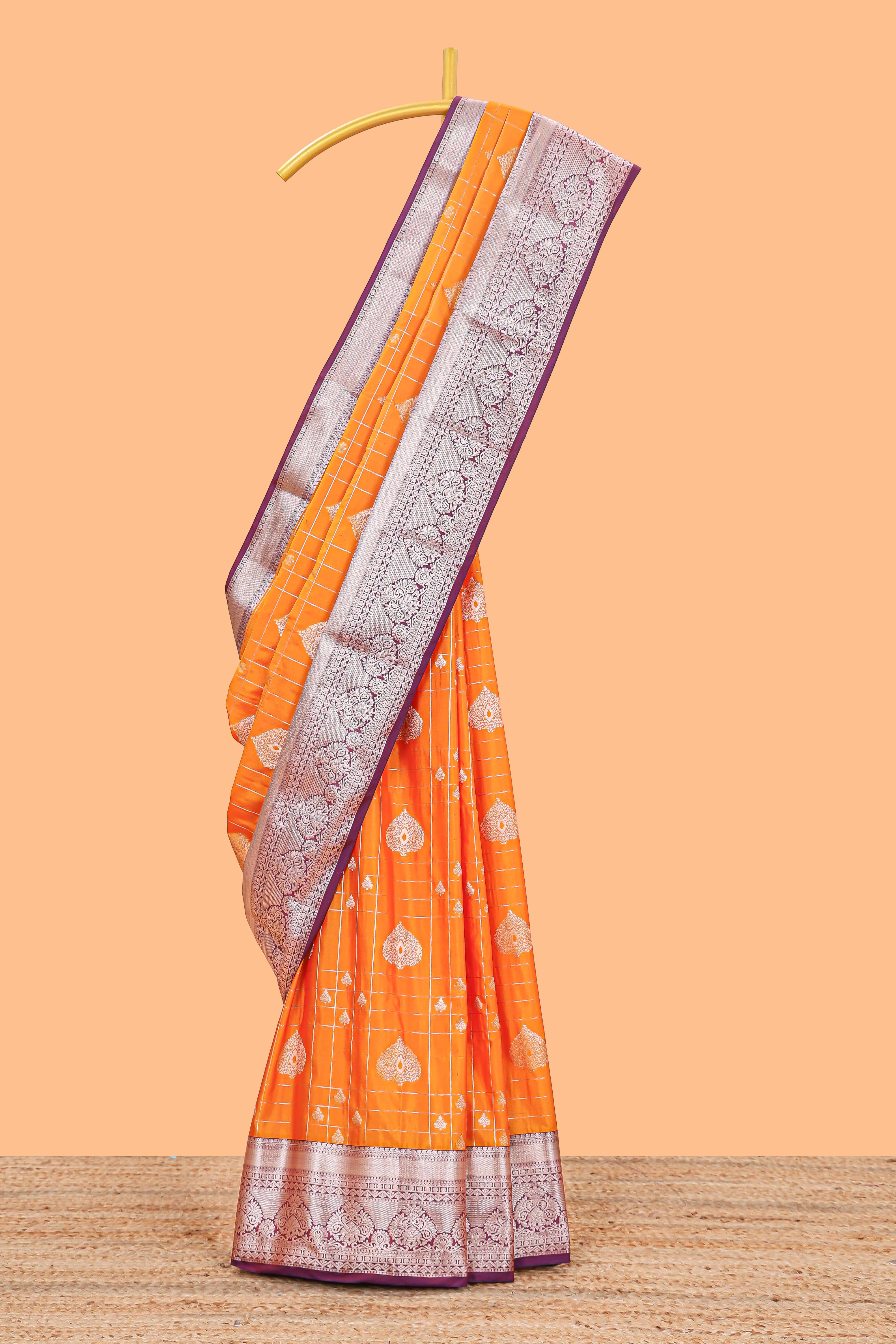 Orange checked zari buttas semi soft silk saree with contrast zari border and floral design pallu