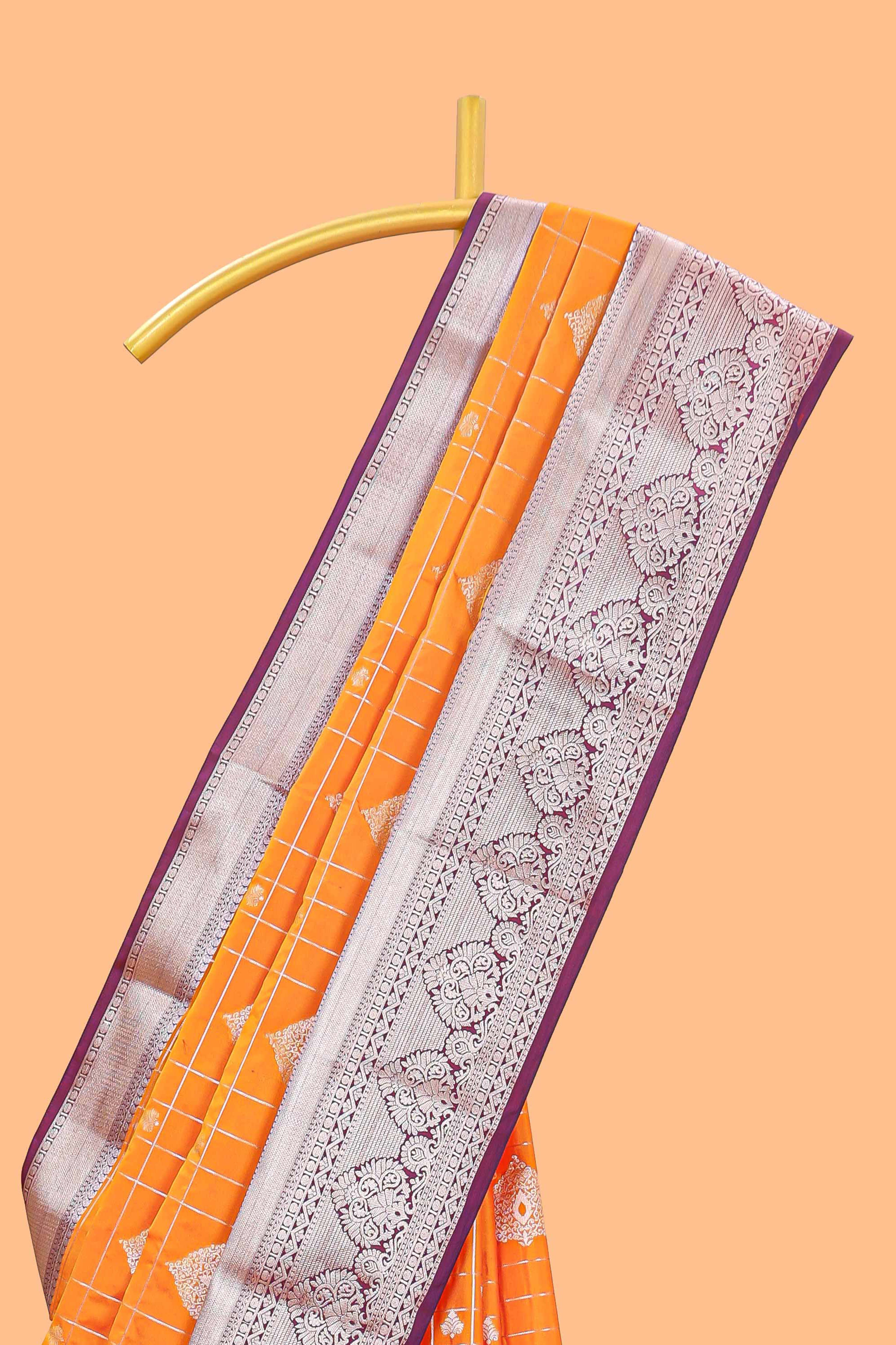 Orange checked zari buttas semi soft silk saree with contrast zari border and floral design pallu