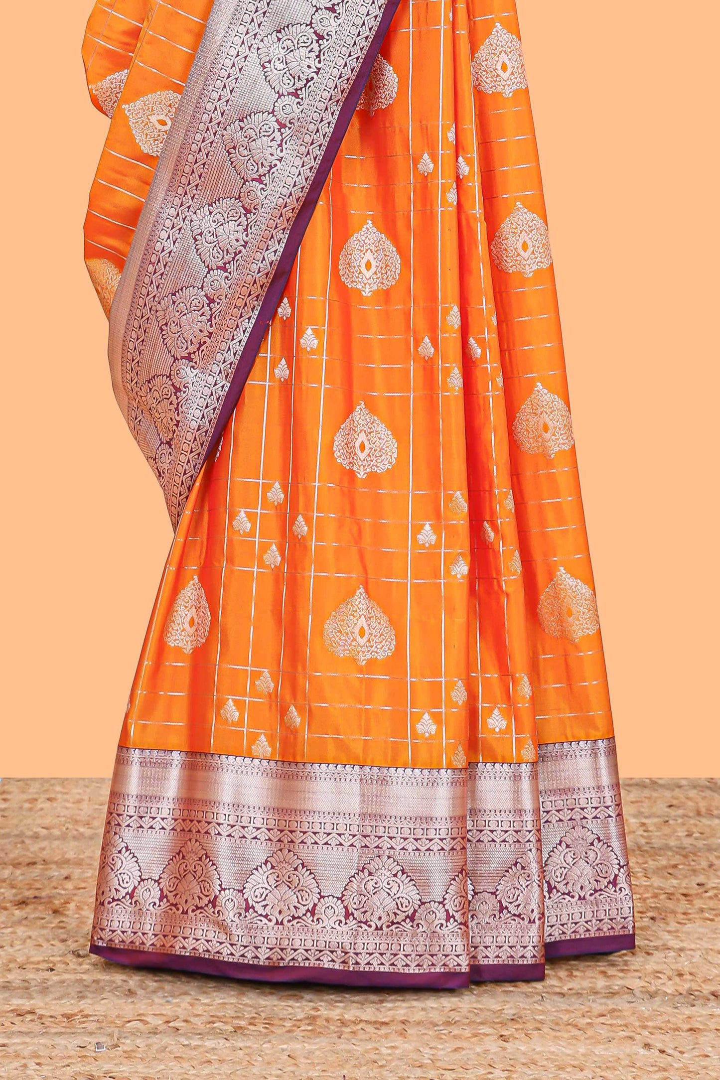 Orange checked zari buttas semi soft silk saree with contrast zari border and floral design pallu