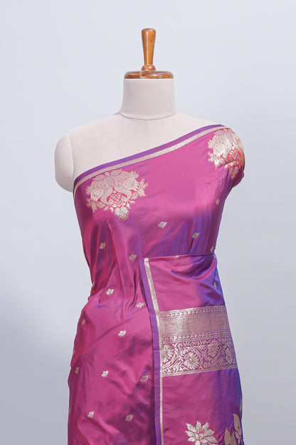 Magenta & purple dual tone floral zari motifs design semi soft silk saree with self border and matching blouse