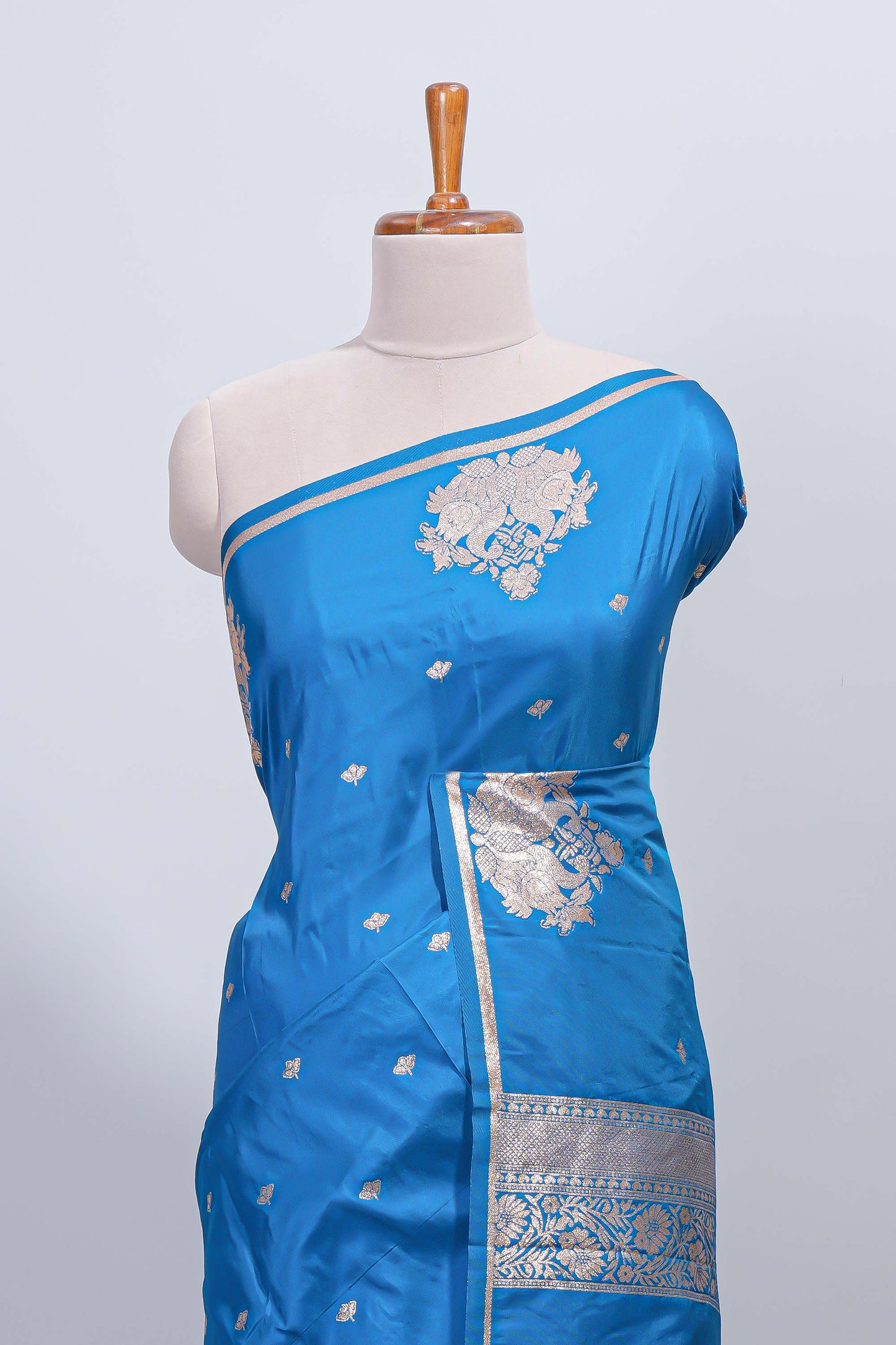 Blue floral zari motifs design semi soft silk saree with self border and matching blouse