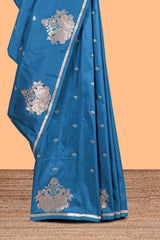 Blue colour Semi soft silk withgold zari floral motifs border with peacock motifs and matching blouse