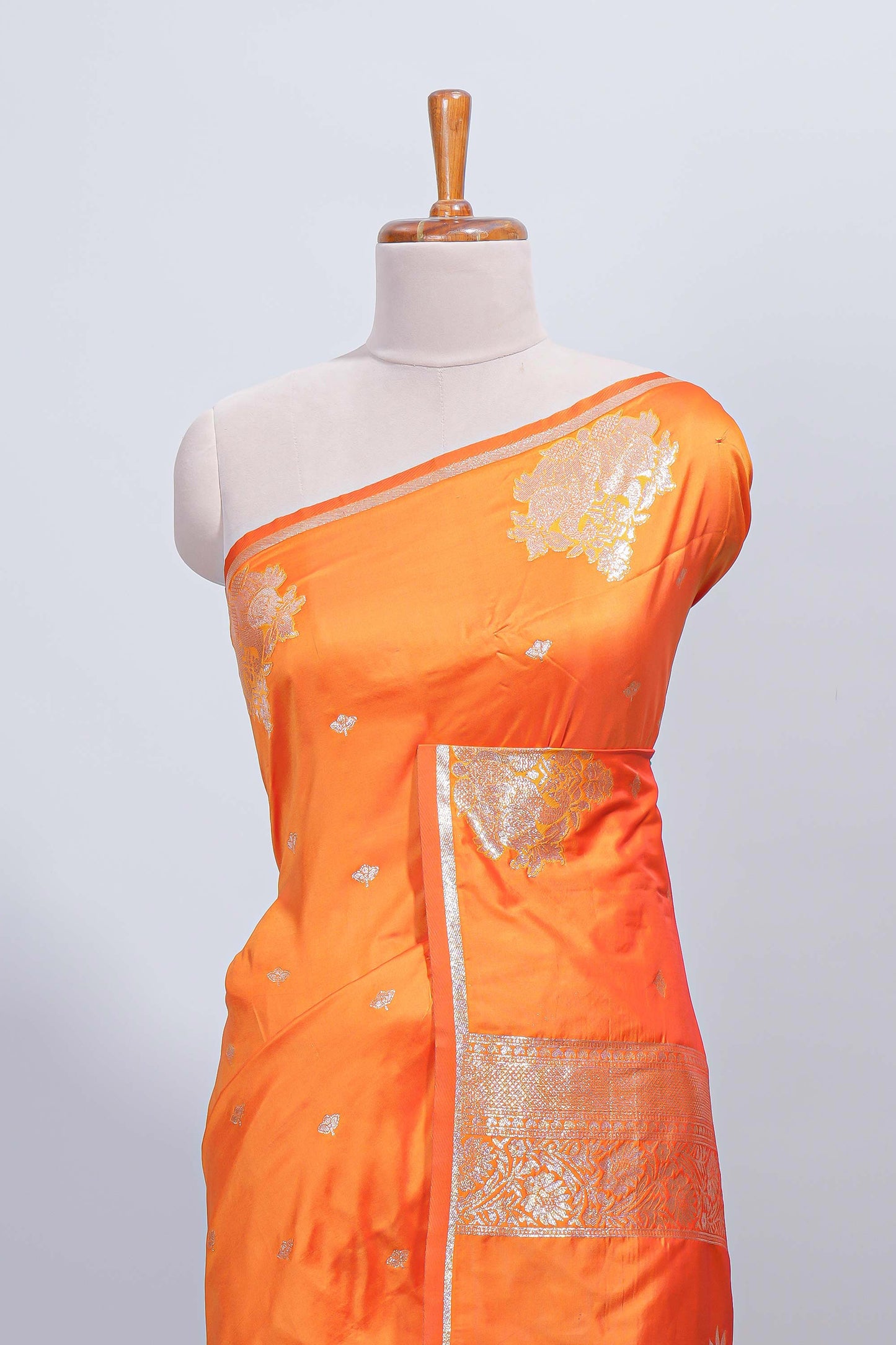 Orange floral zari motifs design semi soft silk saree with self border and matching blouse