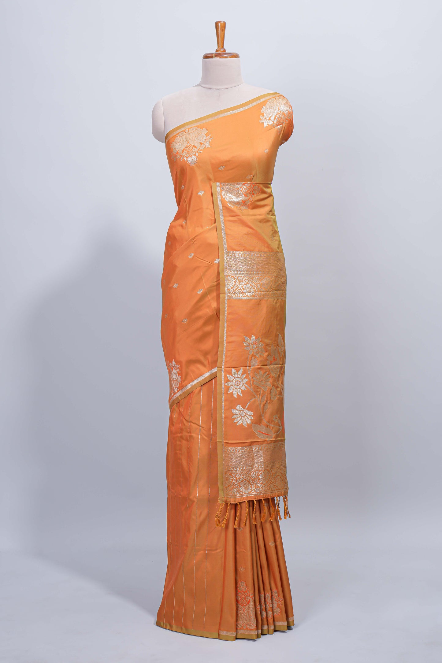 Light orange floral zari motifs design semi soft silk saree with self border and matching blouse