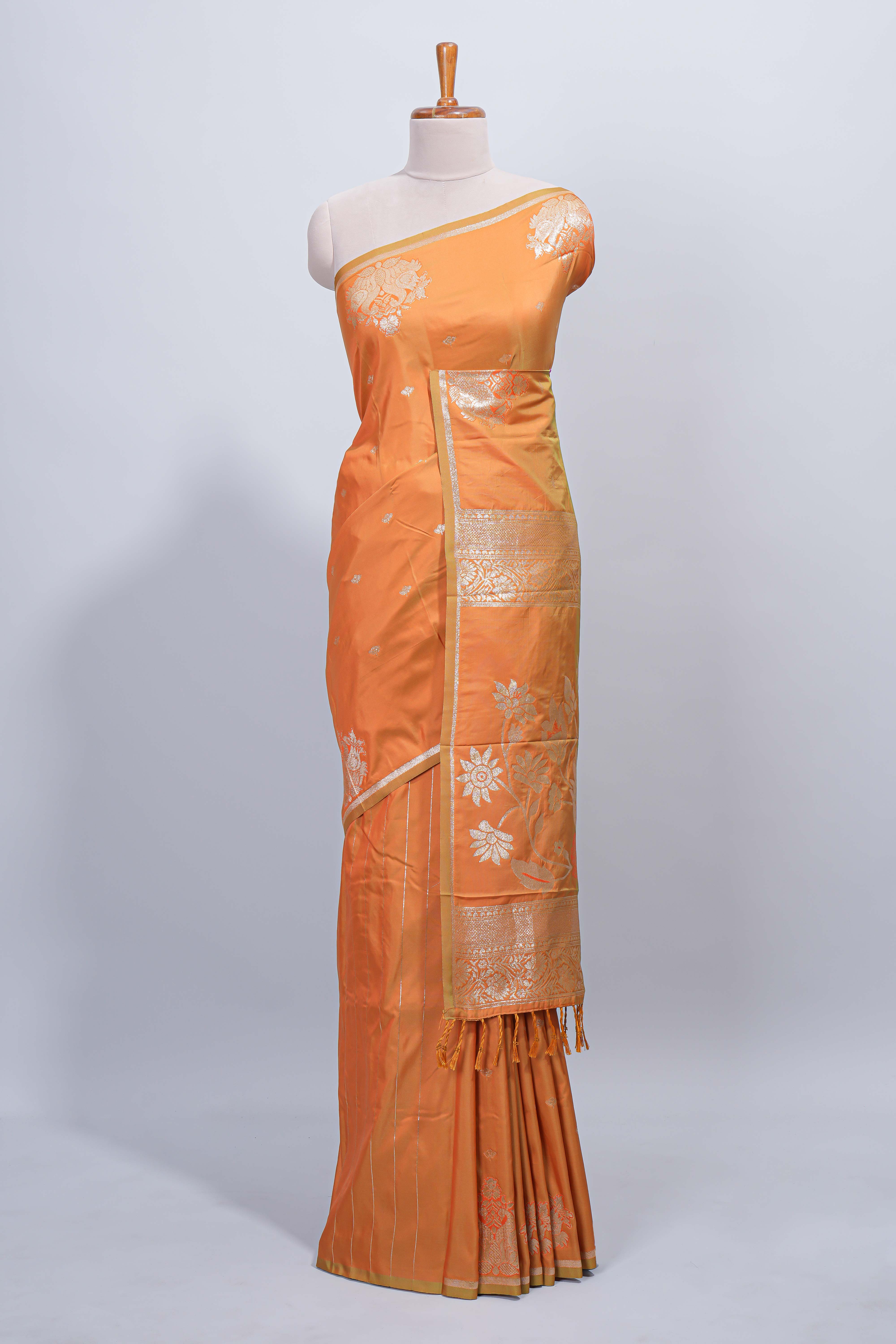 Light orange floral zari motifs design semi soft silk saree with self border and matching blouse