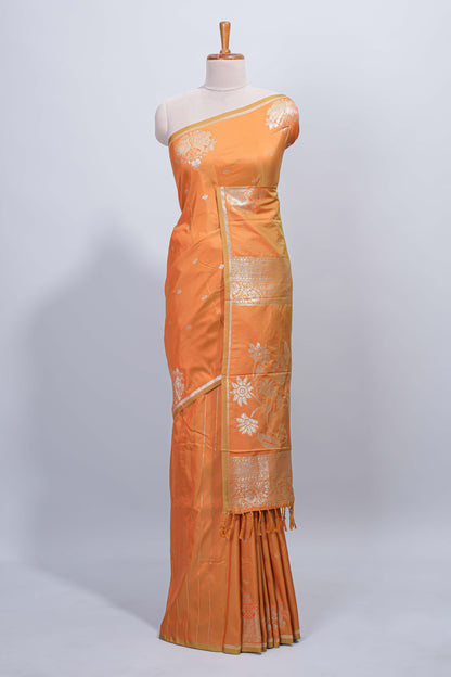 Light orange floral zari motifs design semi soft silk saree with self border and matching blouse