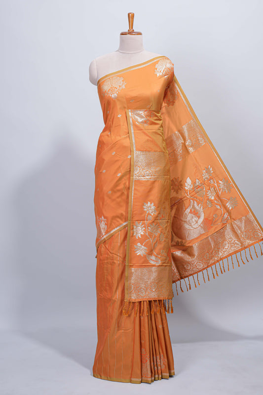 Light orange floral zari motifs design semi soft silk saree with self border and matching blouse