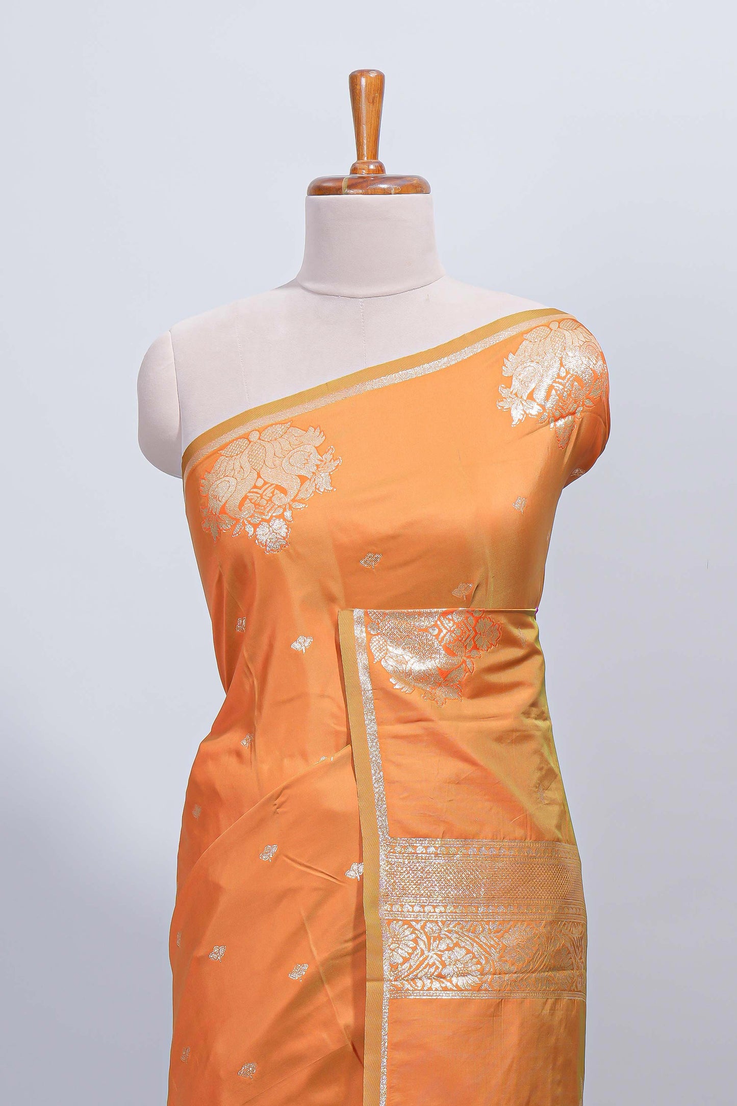 Light orange floral zari motifs design semi soft silk saree with self border and matching blouse