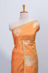 Light orange floral zari motifs design semi soft silk saree with self border and matching blouse