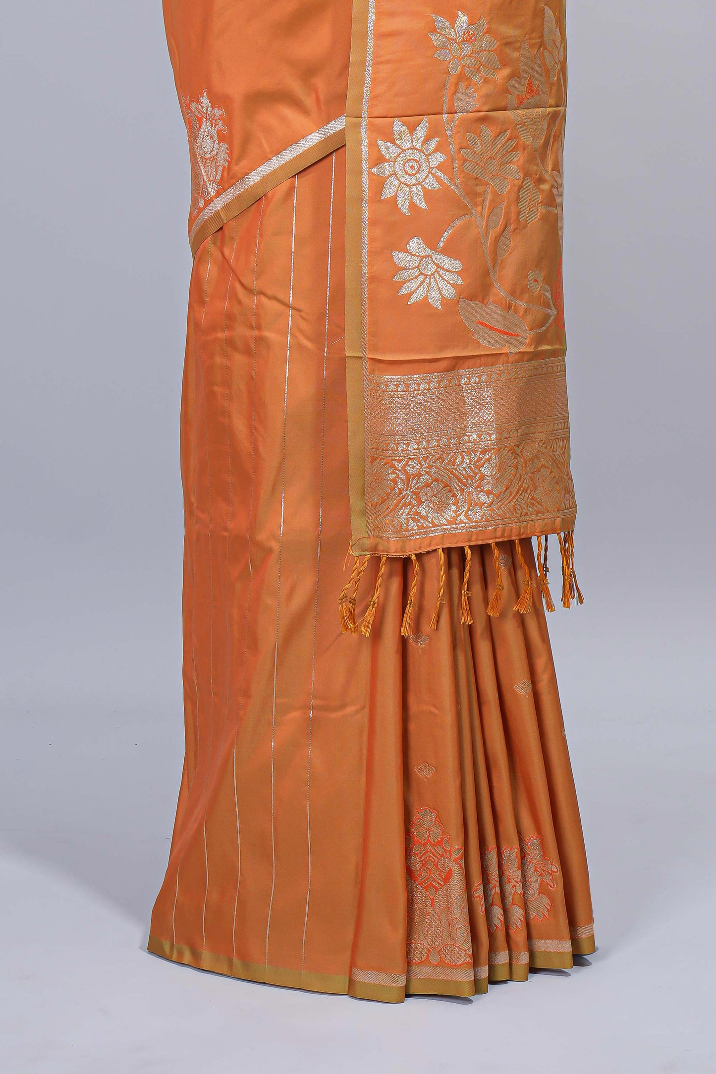 Light orange floral zari motifs design semi soft silk saree with self border and matching blouse