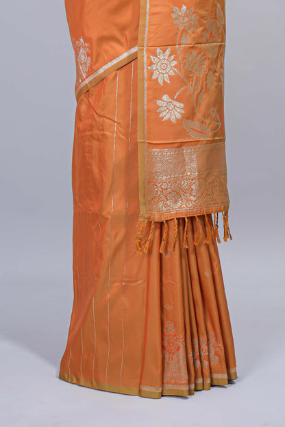 Light orange floral zari motifs design semi soft silk saree with self border and matching blouse