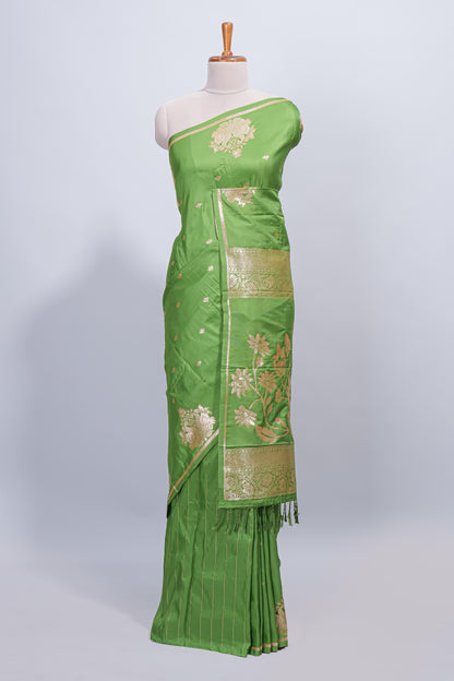 Green floral zari motifs design semi soft silk saree with self border and matching blouse