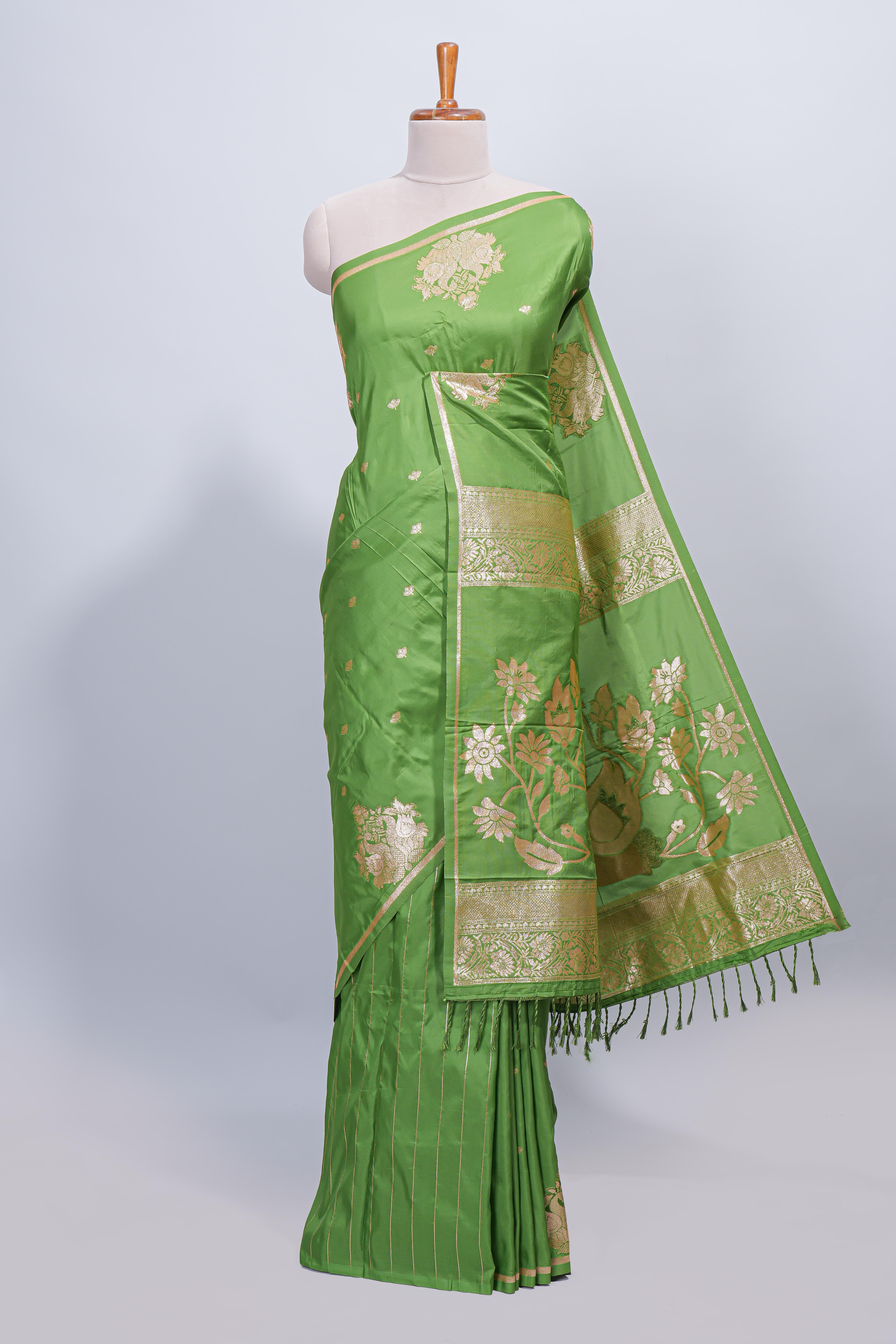 Green floral zari motifs design semi soft silk saree with self border and matching blouse