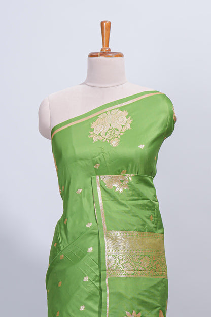 Green floral zari motifs design semi soft silk saree with self border and matching blouse