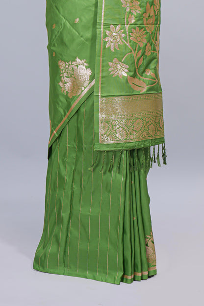 Green floral zari motifs design semi soft silk saree with self border and matching blouse