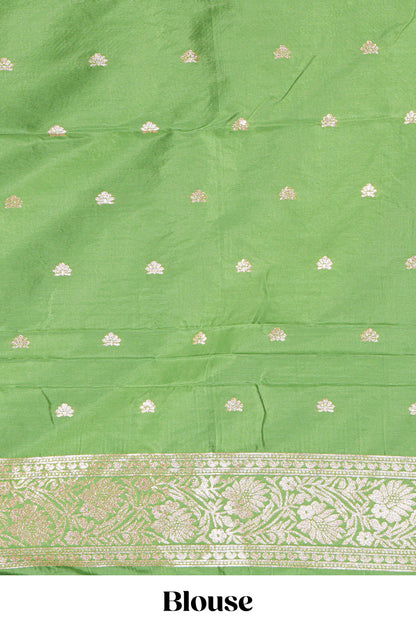 Green floral zari motifs design semi soft silk saree with self border and matching blouse