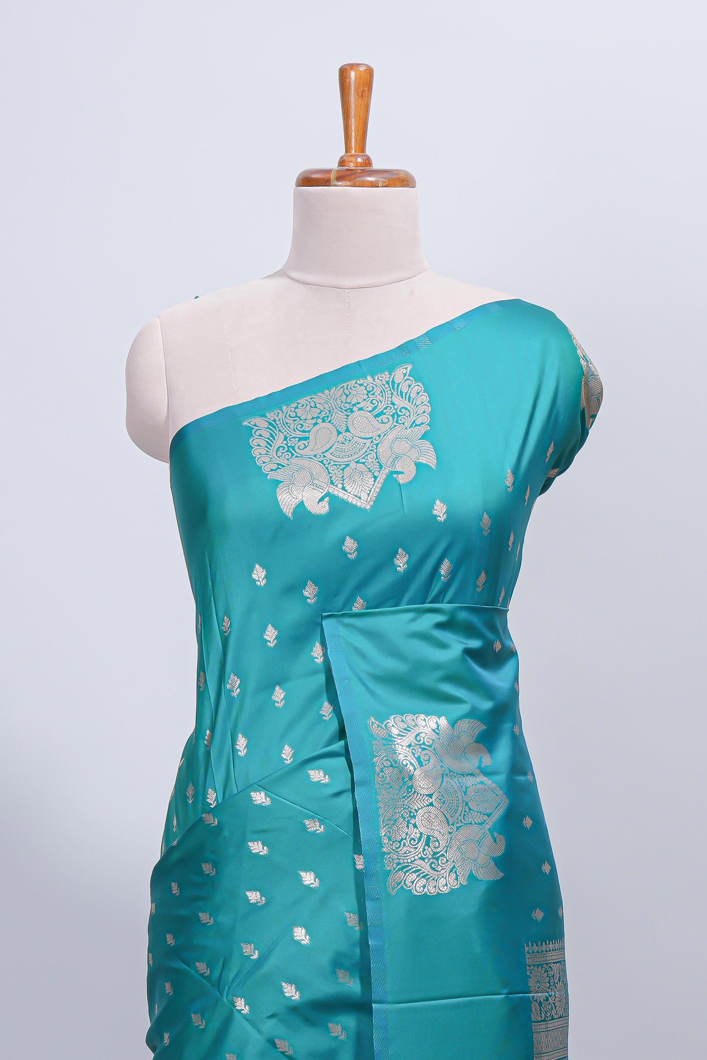 Green floral zari motifs design semi soft silk saree with self border and matching blouse