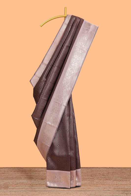 Dark brown checked floral motifs design semi soft silk saree with contrast border and blouse