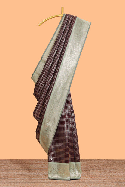 Dark brown checked floral motifs design semi soft silk saree with contrast border and blouse
