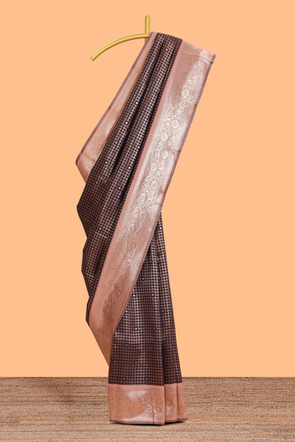 Dark brown checked floral motifs design semi soft silk saree with contrast border and blouse