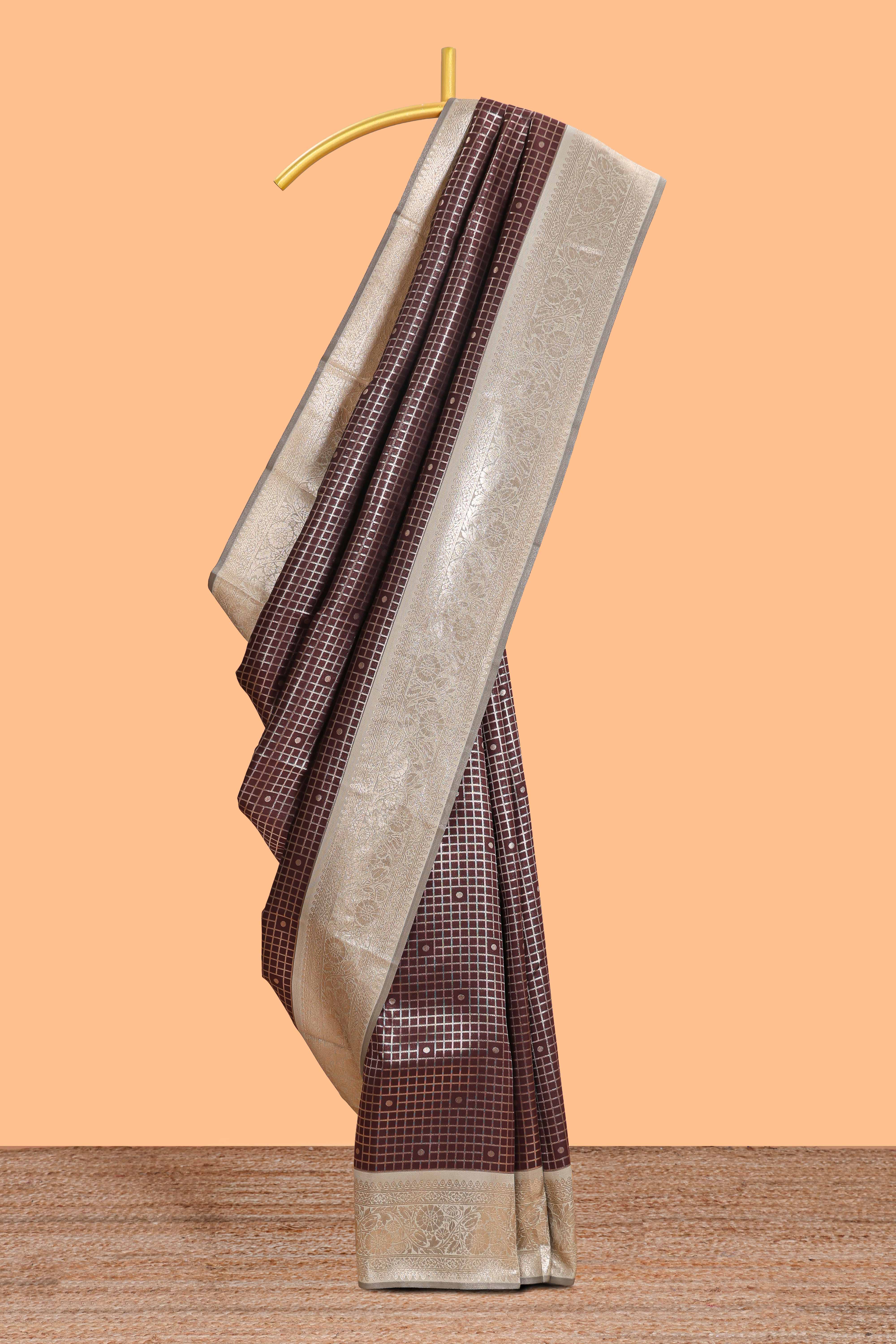 Dark brown checked floral motifs design semi soft silk saree with contrast border and blouse